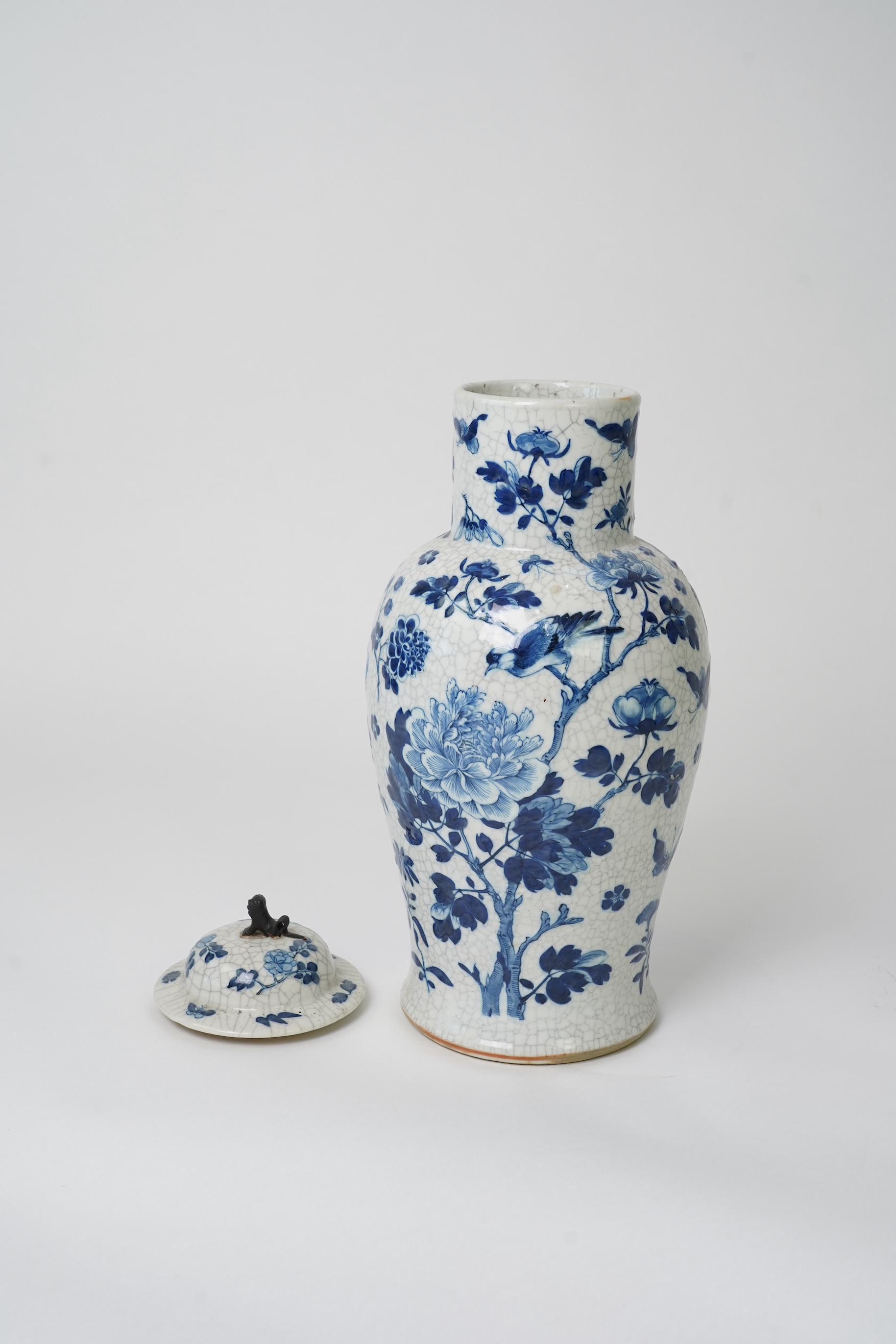 A Chinese blue and white crackle glaze baluster vase and cover, early 20th century